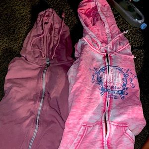 Two pink sweaters